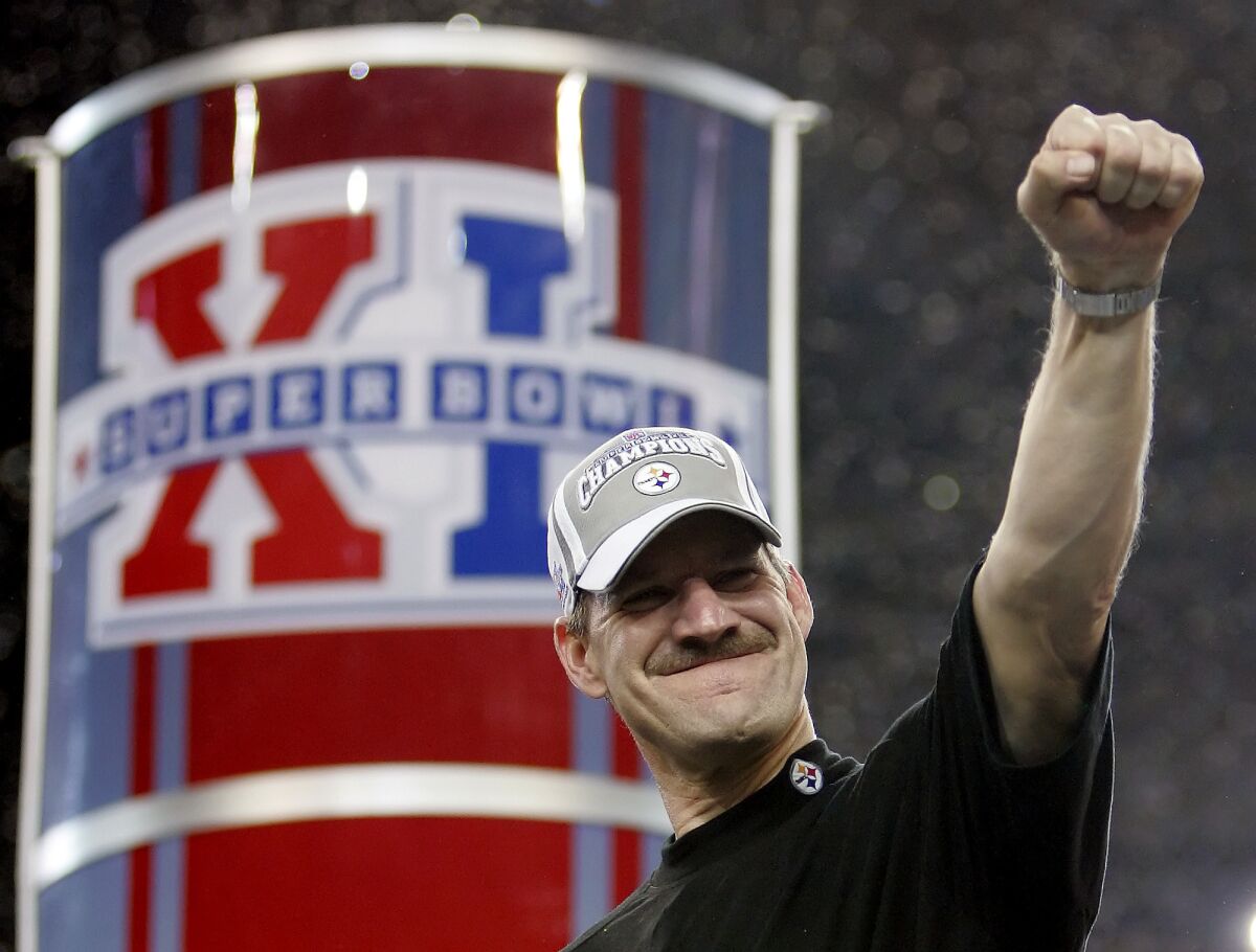 FILE - Pittsburgh Steelers head coach Bill Cowher reacts on the center stage after the Steelers' 21-10 win over the Seattle Seahawks in the Super Bowl XL football game in Detroit, in this Sunday, Feb. 5, 2006, file photo. Cowher, who won 149 games and a Super Bowl in 15 seasons with the Pittsburgh Steelers from 1992-2006, will be inducted into the Pro Football Hall of Fame next month. (AP Photo/David J. Phillip, File)