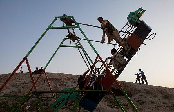 Afghans avail themselves to the equipment at a park in the capital. President Hamid Karzai has extended his lead over his top challenger in the recent vote, but he is still short of a majority.