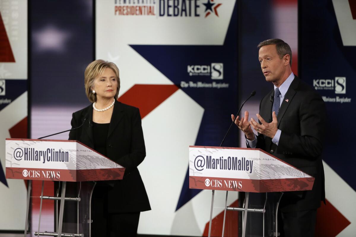 Martin O'Malley makes a point as Hillary Rodham Clinton listens during a Democratic presidential primary debate, Saturday, Nov. 14, 2015, in Des Moines, Iowa. (AP Photo/Charlie Neibergall)