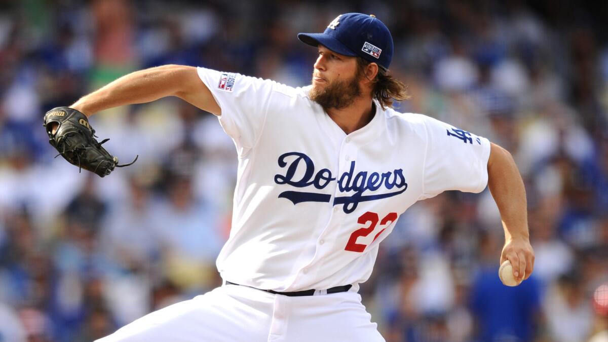 Dodgers starter Clayton Kershaw delivers a pitch during the team's loss to the St. Louis Cardinals in Game 1 of the National League division series on Friday.