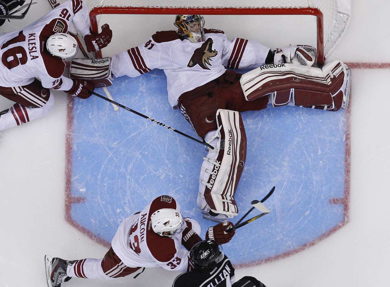 Coyotes goalie Mike Smith spreads out to stop a Kings shot in the second period of Game 4 on Sunday afternoon at Staples Center. Smith turned away 36 shots for a 2-0 victory, his third shutout of the postseason.