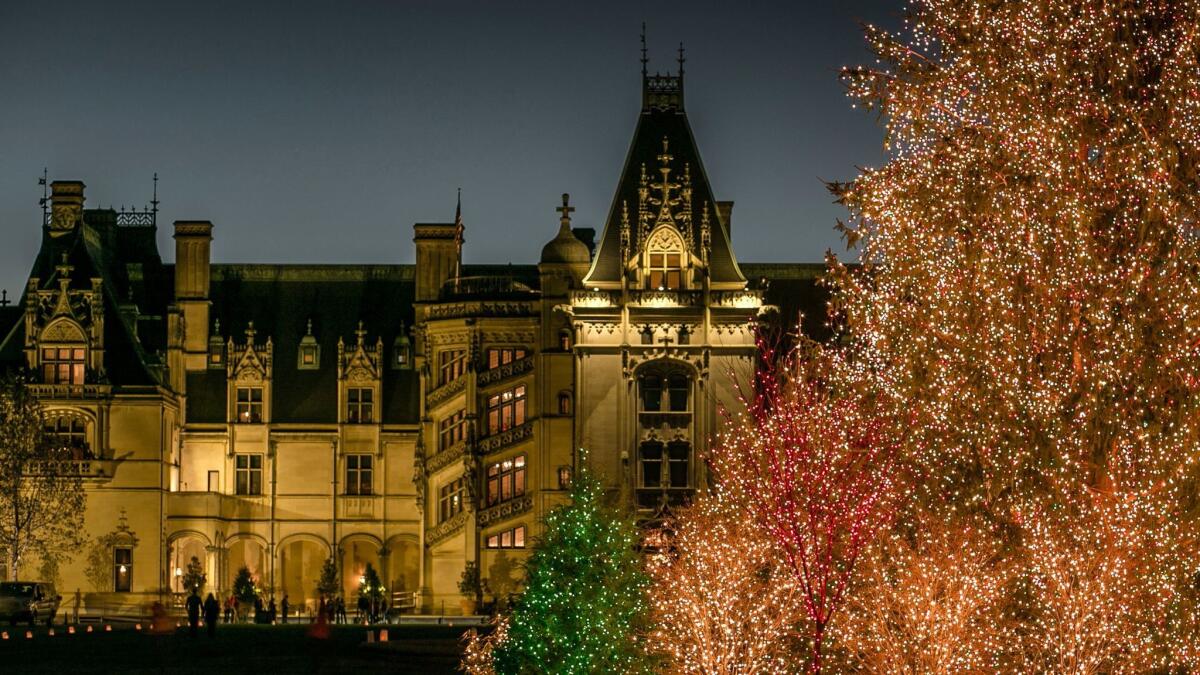 The Biltmore House in Asheville, N.C, is bright with holiday lights. Shop now, ticket experts say.