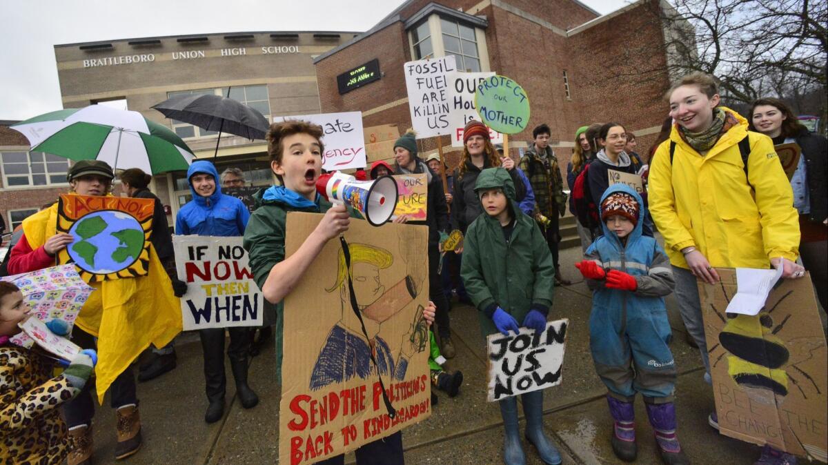 Students attend a climate change rally in Brattleboro, Vt. A new study shows that when children learn about climate change in school, their parents become more concerned about the issue.