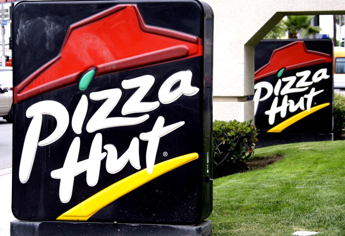 Signage in front of a Pizza Hut restaurant is seen in Los Angeles.