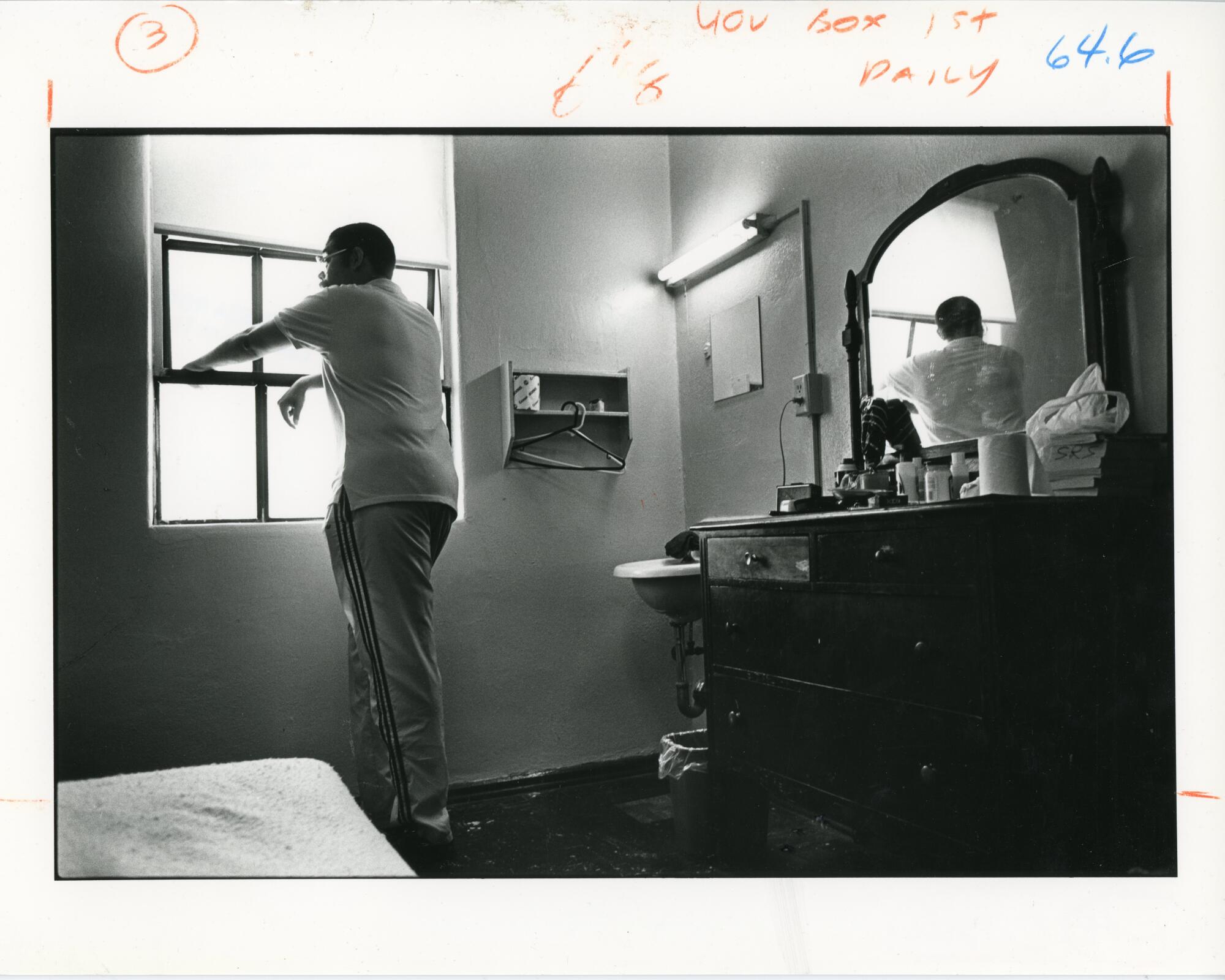 A man finds temporary housing at the Russ Hotel.
