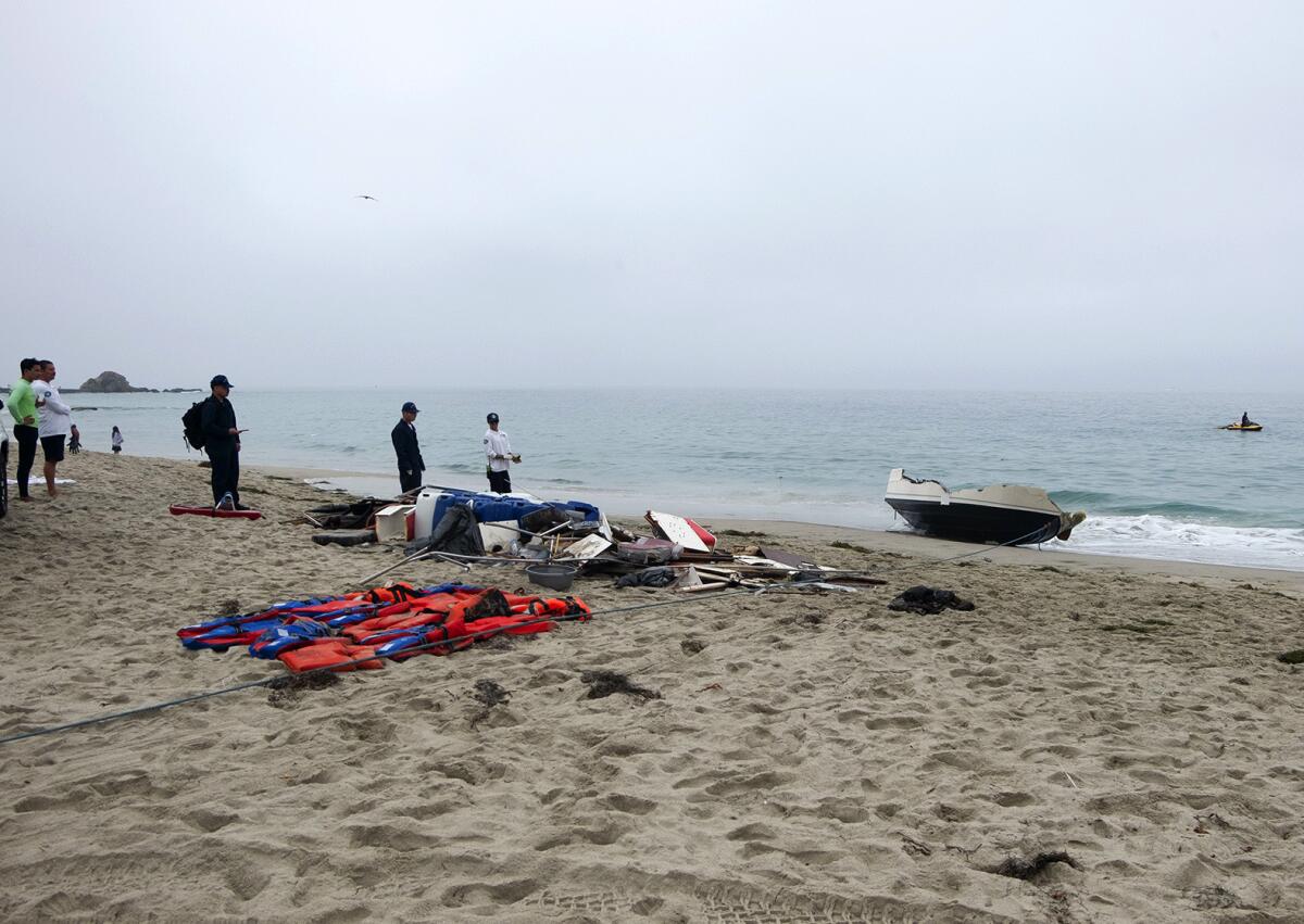 People on a beach with items on the sand