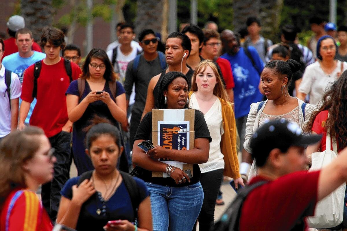 Students walk to class at Santa Monica College. Santa Monica sent 783 students to UC campuses last year, by far the most of 112 community colleges in the state.