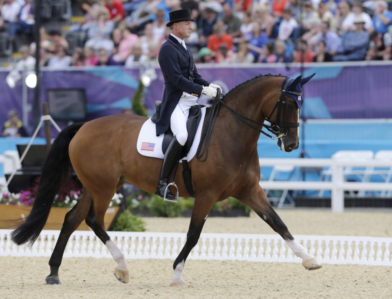 Jan Ebeling of the United States rides Rafalca in the individual grand prix during the equestrian dressage competition at the London Olympics. Ann Romney, wife of U.S. Republic presidential candidate, Mitt Romney, is part-owner of the horse.