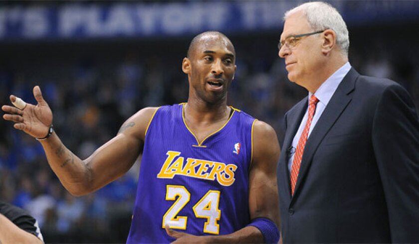Kobe Bryant speaks to then-Lakers coach Phil Jackson during the 2011 playoffs.