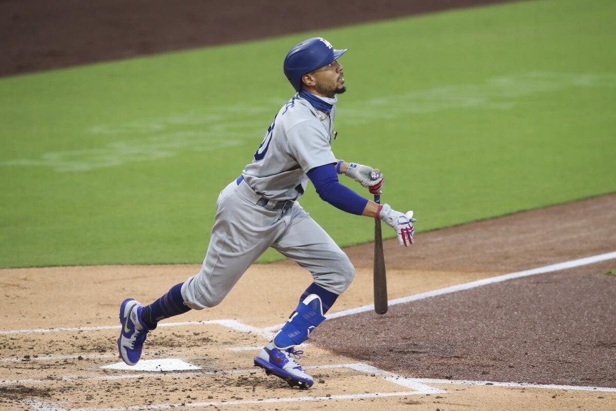 Dodgers' Mookie Betts doubles to right field against the San Diego Padres 