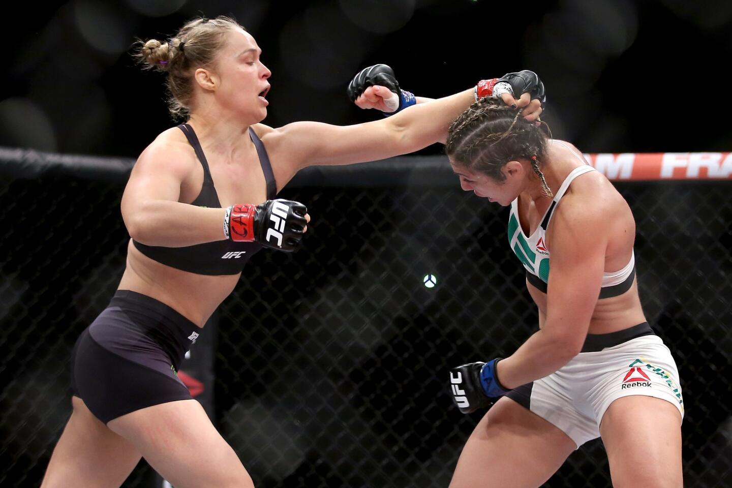 Ronda Rousey, left, was in attack mode from the beginning Saturday against Bethe Correia.