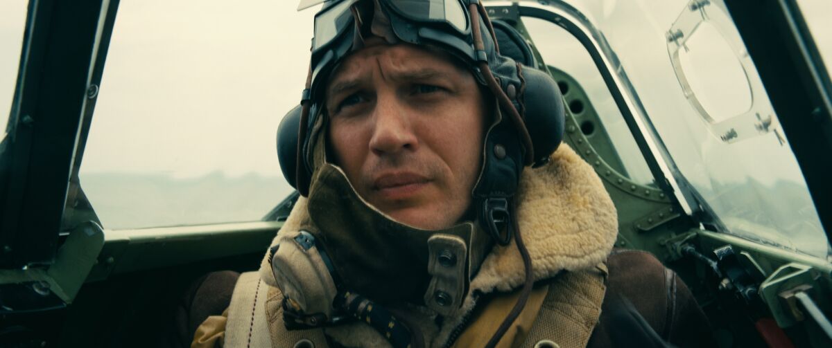 The actor Tom Hardy sits in the cockpit of a WWII fighter plane in the 2017 film "Dunkirk."