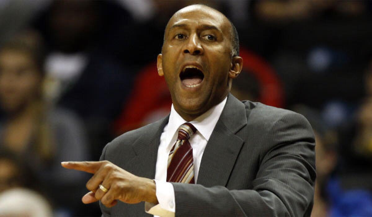 Stanford Coach Johnny Dawkins directs his team against the Michigan Wolverines last month.