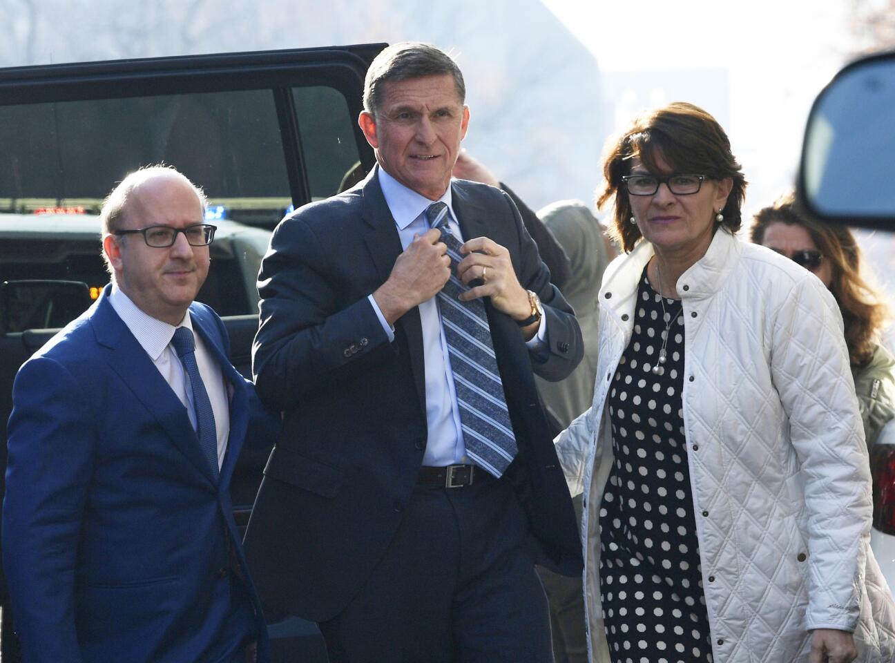 Former national security adviser Michael Flynn, center, arrives at federal court in Washington, D.C., on Dec. 1, 2017. Court documents show Flynn, an early and vocal supporter of Donald Trump's on his campaign trail whose business dealings and foreign interactions made him a central focus of Robert Mueller's investigation, was expected to admit to lying about his conversations with Russia's ambassador to the United States during the transition period before President Trump's inauguration.