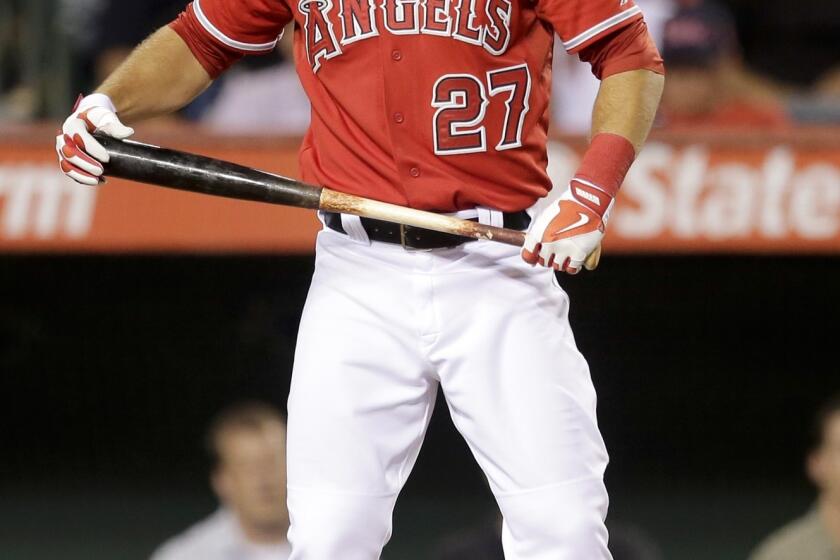 Angels left fielder Mike Trout reacts after striking out during the fifth inning of the Angels' 10-5 loss to the Oakland Athletics.