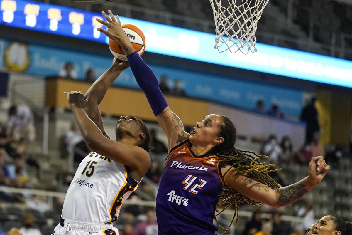 Phoenix Mercury center Brittney Griner (42) blocks the shot of Indiana Fever forward Teaira McCowan (15) in the second half of a WNBA basketball game in Indianapolis, Monday, Sept. 6, 2021. (AP Photo/Michael Conroy)