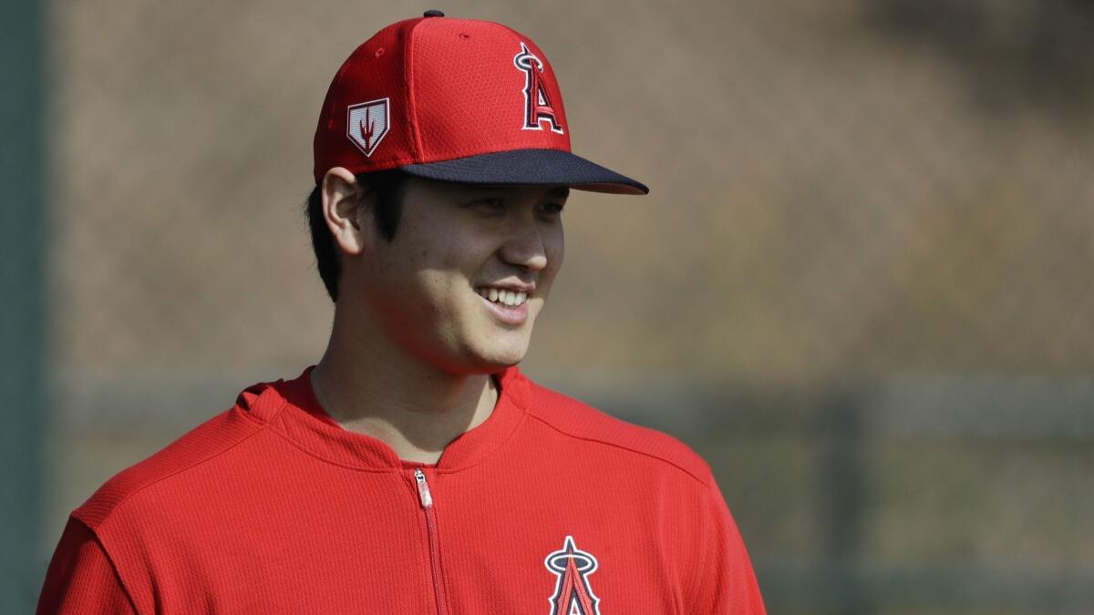 Angels' Shohei Ohtani walks on the practice field at their spring baseball training facility in Tempe, Ariz. on Feb. 15, 2019.