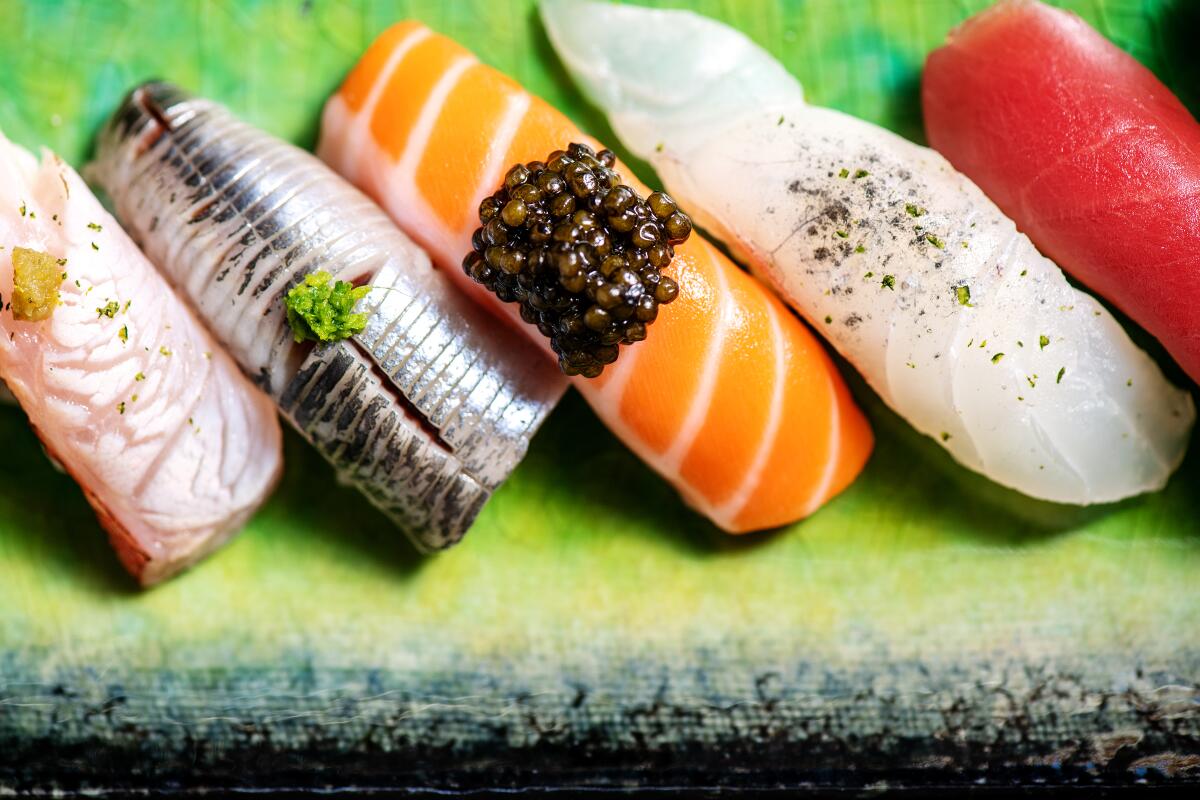 A plate with five pieces of sushi