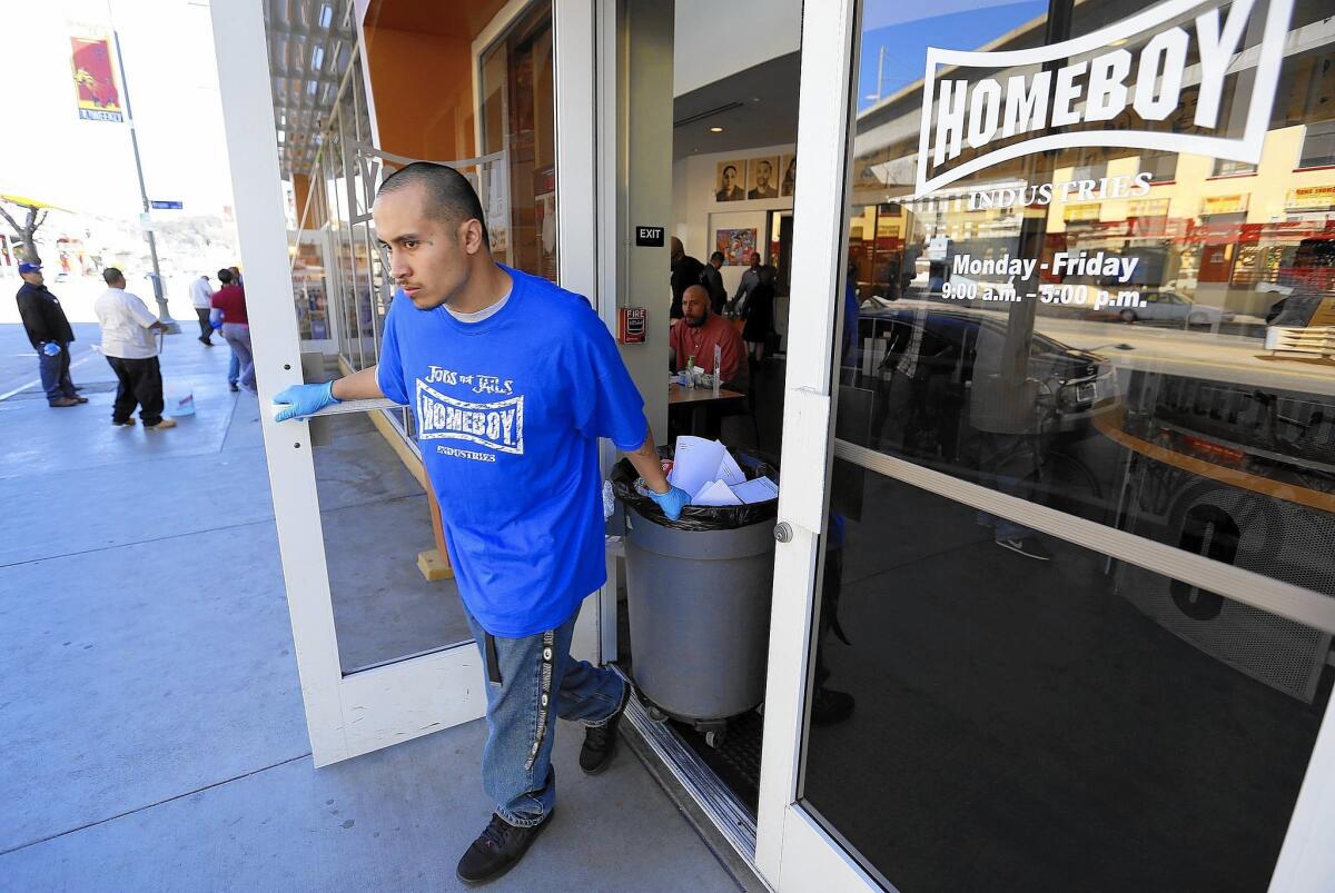 Garai Bastida does work at Homeboy Industries. The nonprofit, which helps former gang members and ex-inmates turn their lives around, says it will have to reduce the number of people it serves if it doesn't get a temporary wage-hike exemption for workers in training programs.
