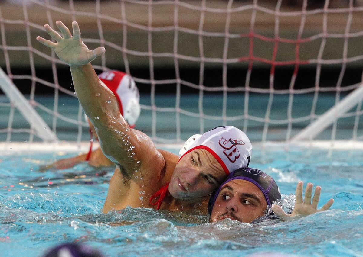 Burroughs' Vahagan Sahakyan and Hoover's Hayk Nazaryan battle in front of the Burroughs goal in the Pacific League preliminary boys' water polo tournament at Arcadia High School on Tuesday, October 29, 2019. Hoover won the game advancing to the finals.