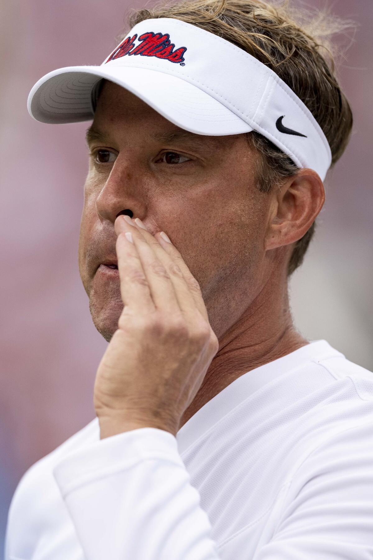Mississippi head coach Lane Kiffin whistles to a player during warm-ups before an NCAA college football game against Alabama, Saturday, Oct. 2, 2021, in Tuscaloosa, Ala. (AP Photo/Vasha Hunt)