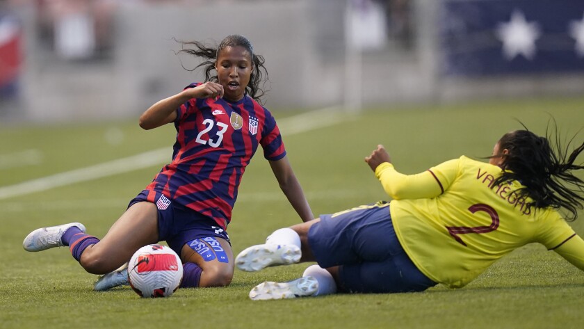 U.S. forward Margaret Purce (23) and Colombia's Manuela Vanegas (2) vie for the ball 