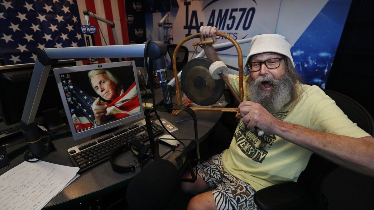 Radio sports announcer Vic "the Brick" Jacobs is photographed inside the studio at iHeartMedia in Burbank, after giving a sports update on the radio show, "Petros and Money".