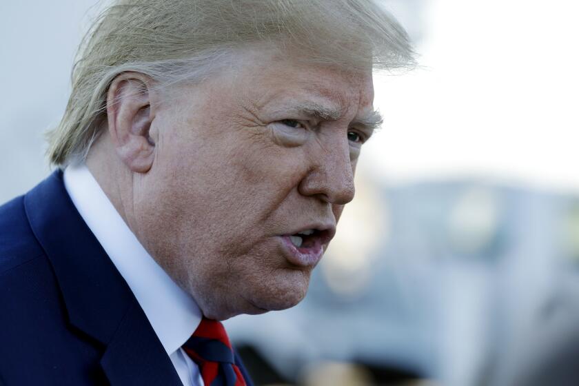 President Donald Trump talks to reporters before boarding Air Force One for a trip to Chicago to attend the International Association of Chiefs of Police Annual Conference and Exposition, Monday, Oct. 28, 2019, in Andrews Air Force Base, Md. (AP Photo/Evan Vucci)