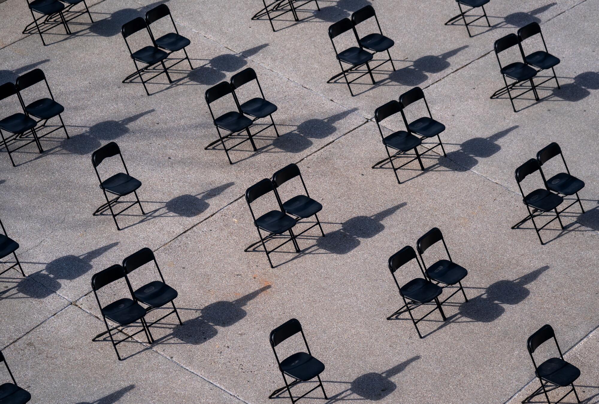 Socially distant folding chairs on the west front of the U.S. Capitol Building.
