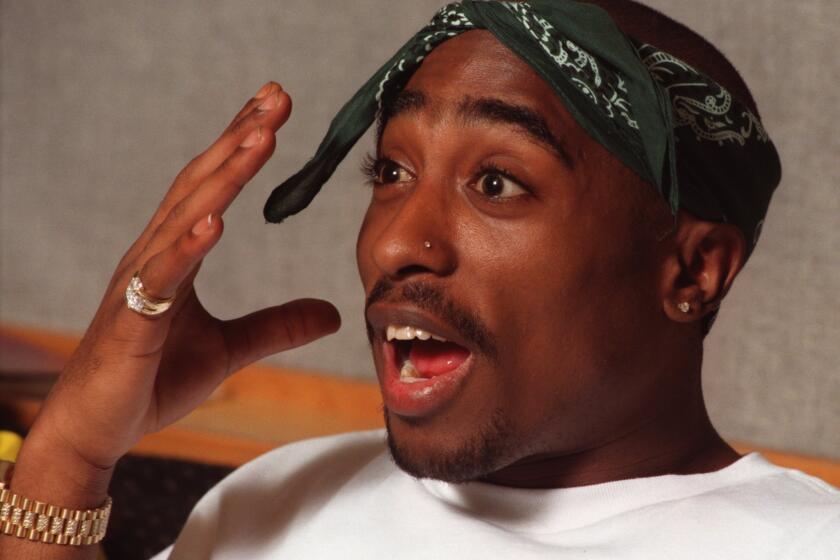 The death of rapper-actor Tupac Shakur, shown in 1995, is still considered a mystery and a tragic milestone in music.