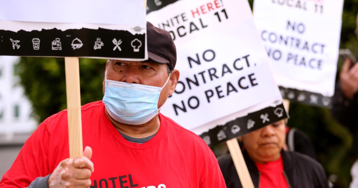 Striking hotel workers reach a tentative contract agreement with a fifth hotel