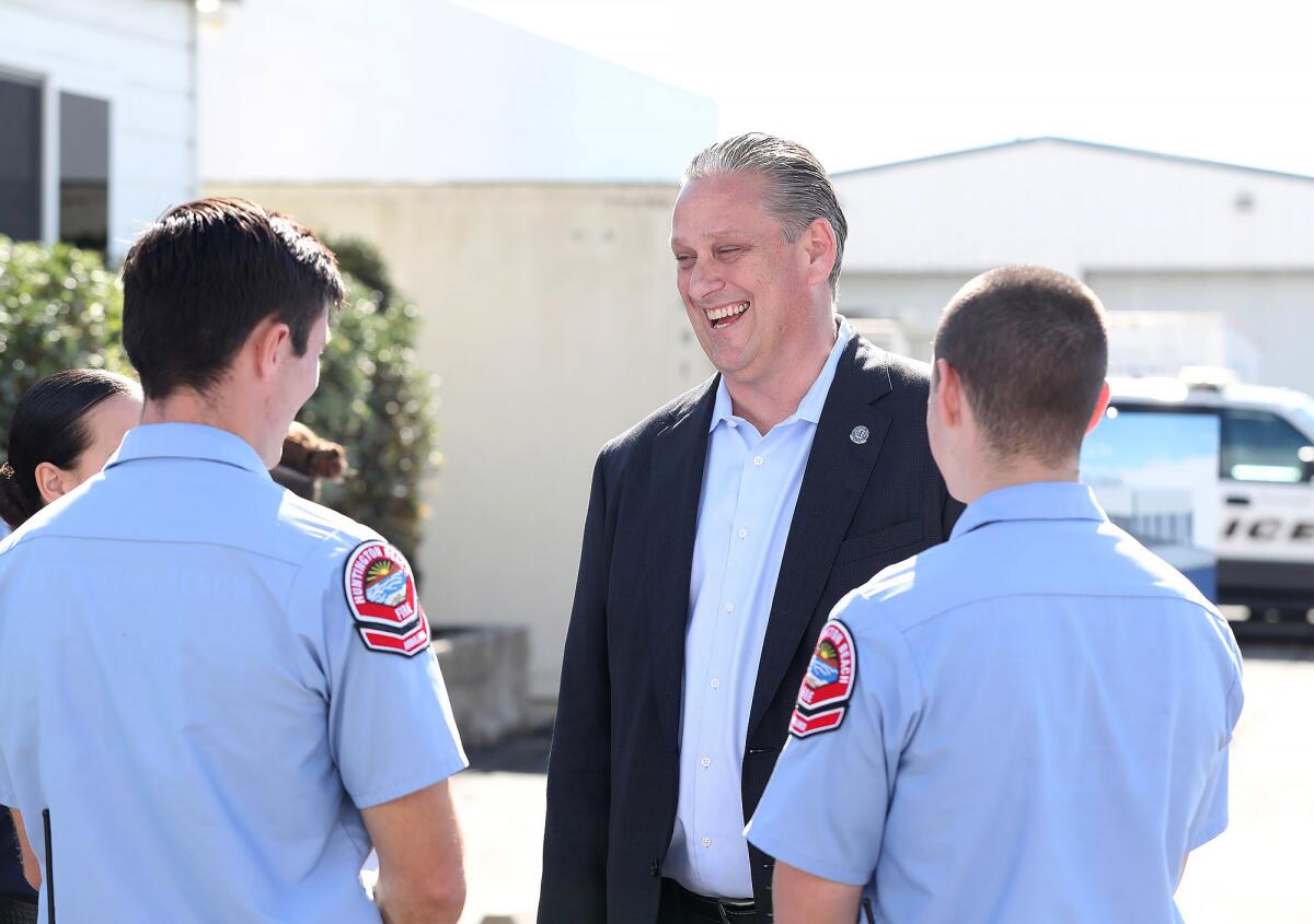 Huntington Beach Mayor Tony Strickland chats with a crew of explorers after Thursday's groundbreaking ceremony.