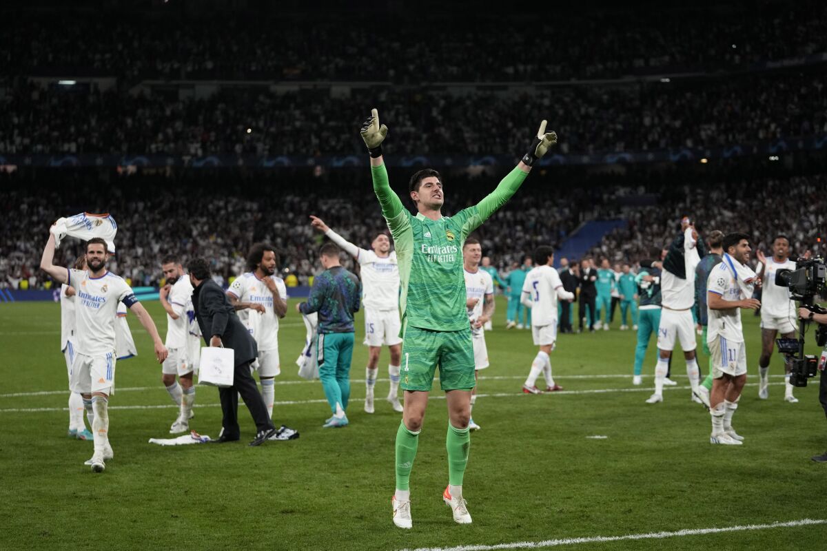 Real Madrid's goalkeeper Thibaut Courtois celebrates after the Champions League semi final, second leg, soccer match between Real Madrid and Manchester City at the Santiago Bernabeu stadium in Madrid, Spain, Wednesday, May 4, 2022. Real won 3-1. (AP Photo/Bernat Armangue)