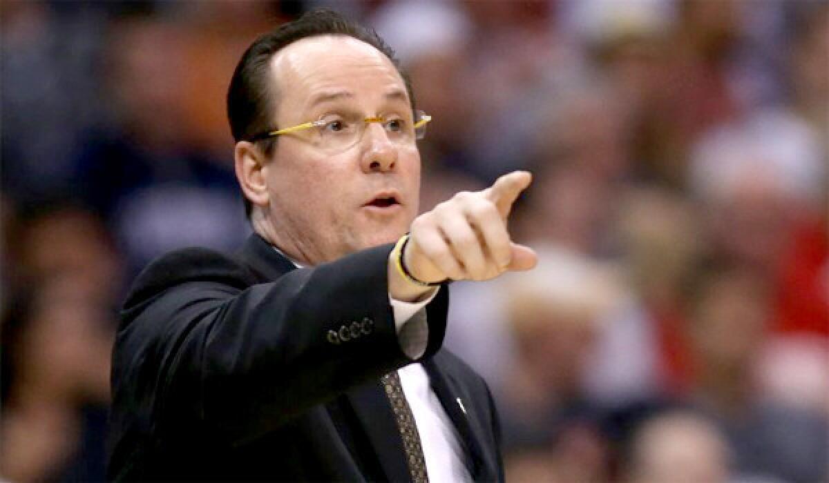 Wichita State Coach Gregg Marshall is one of several coaches who have been mentioned as a candidate for the vacant UCLA job, but he says he's happy where he is now.
