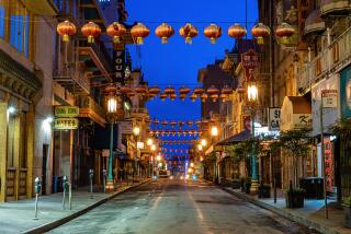 An empty Chinatown in San Francisco at blue hour during the COVID-19 pandemic.