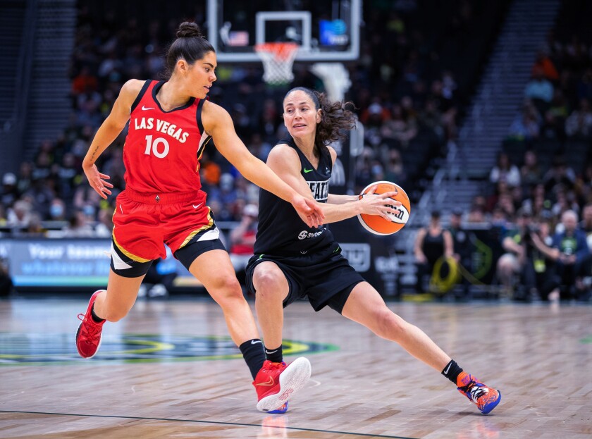 Seattle Storm's Sue Bird stops as Las Vegas Aces' Kelsey Plum defends during the first half of a WNBA basketball game Wednesday, June 29, 2022, in Seattle. (Dean Rutz/The Seattle Times via AP)