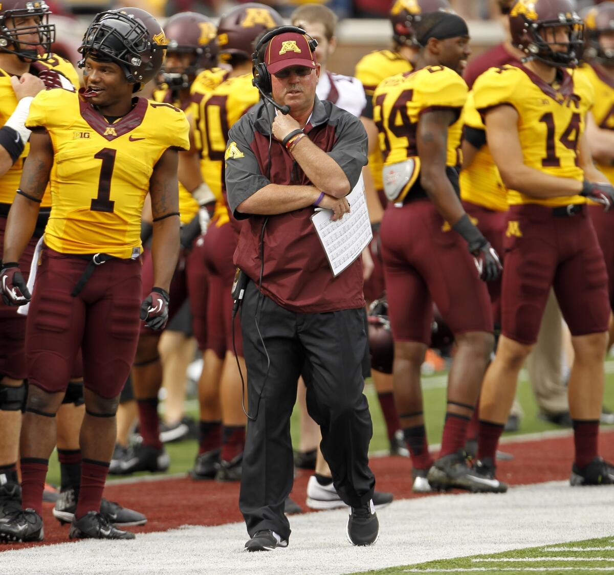 Minnesota Coach Jerry Kill walks the sideline during the first half of the Golden Gophers' game against Western Illinois on Saturday.