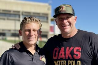 Oaks Christian water poloo coach Jack Kocur with his son, Cam, a standout player for the team.