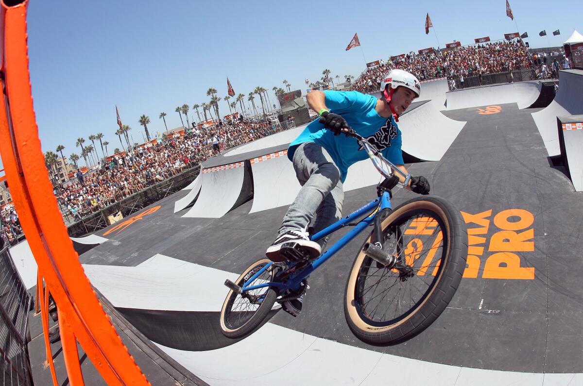 Pat Casey is riding a bike and competing in the Hurley U.S. Open of Surfing.