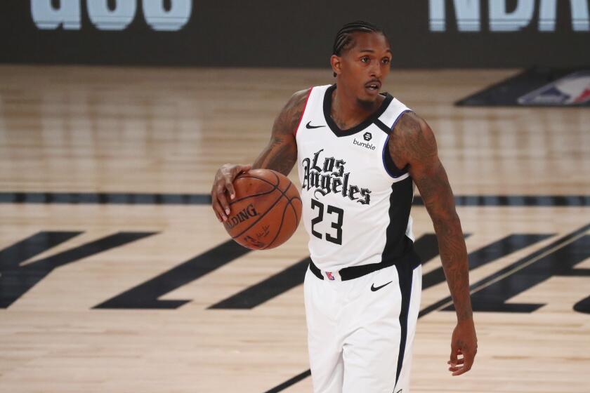 Los Angeles Clippers' guard Lou Williams (23) controls the ball against the Denver Nuggets during the first half of an NBA basketball game Wednesday, Aug. 12, 2020, in Lake Buena Vista, Fla. (Kim Klement/Pool Photo via AP)