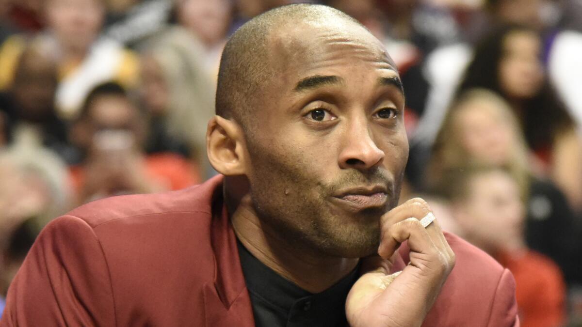 Lakers guard Kobe Bryant watches from the bench during a loss to the Chicago Bulls on Christmas Day.