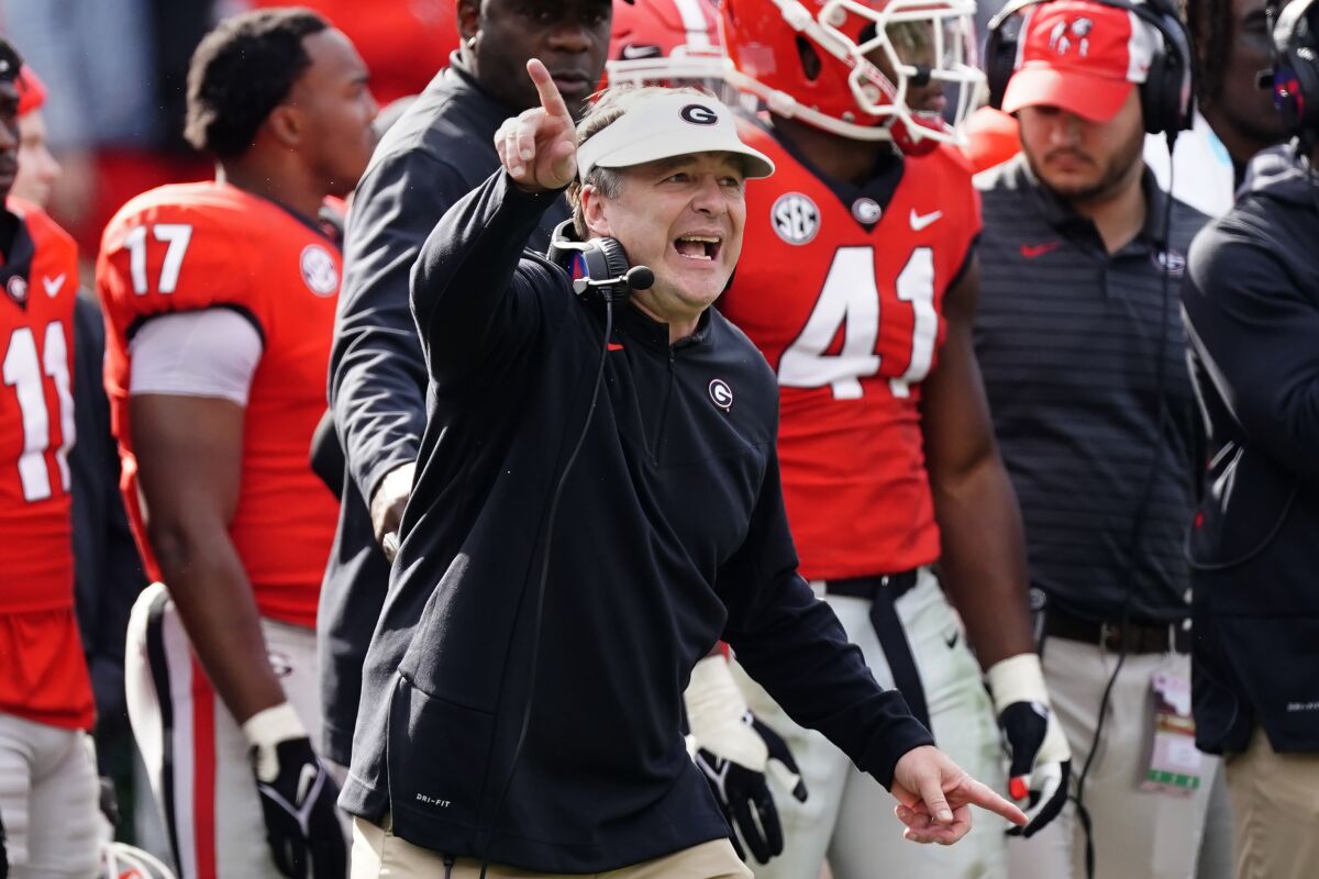 Georgia head coach Kirby Smart directs his players on the field in the second half of an NCAA college football game against Missouri Saturday, Nov. 6, 2021, in Athens, Ga.. (AP Photo/John Bazemore)