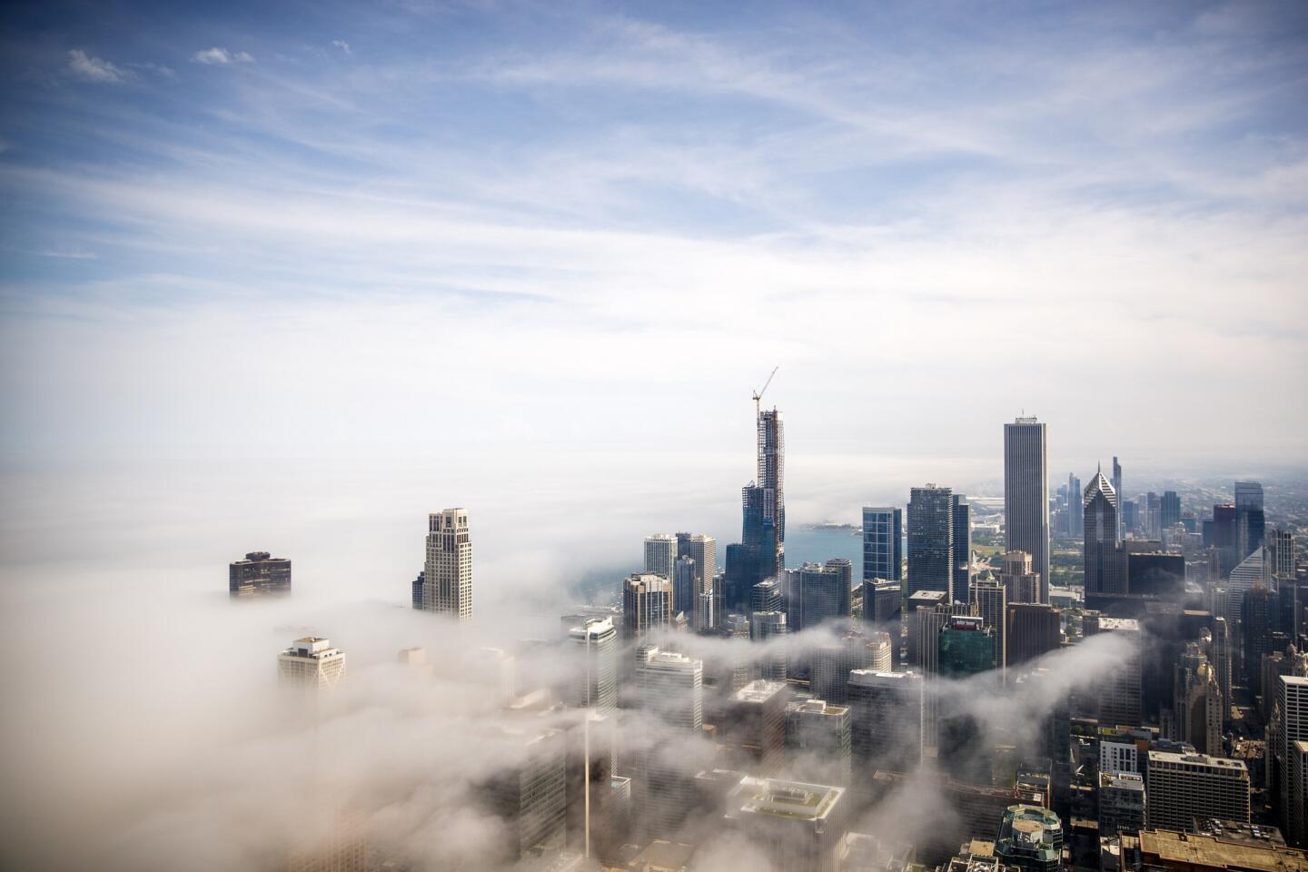 The view for the 360 Chicago observation deck as fog passes through the downtown area, June 6, 2019, in Chicago.