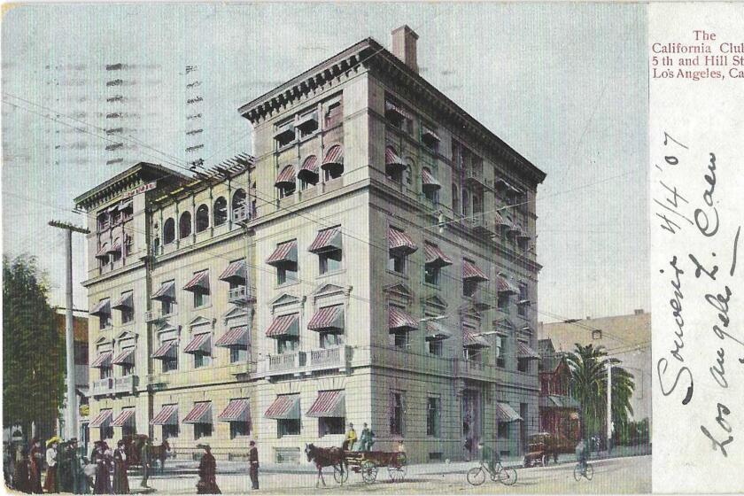 Street scene and exterior view of California Club, with red and white striped awnings