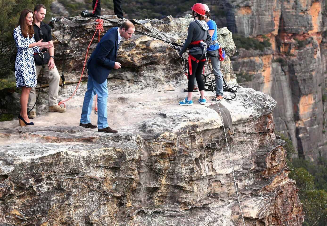 William looks over the cliff edge as he and his wife observe rappelling and team-building exercises at Narrow Neck Lookout near Katoomba, Australia.