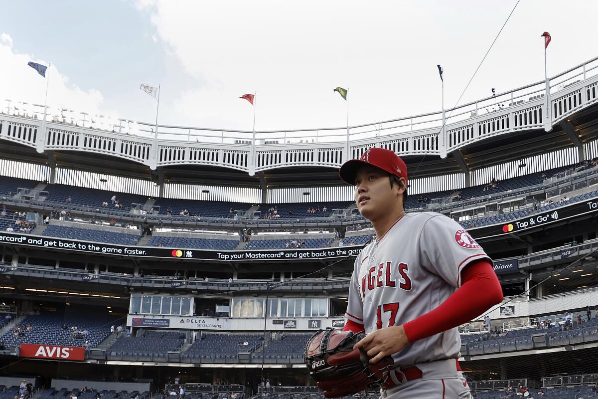 Angels pitcher Shohei Ohtani walks onto the field before a game at Yankees Stadium on June 30.