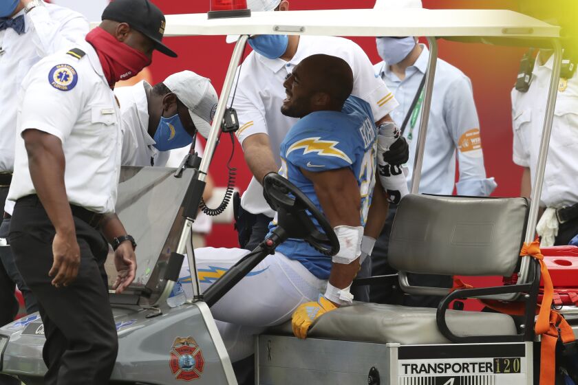 Los Angeles Chargers running back Austin Ekeler (30) is carted off the field after getting hurt.