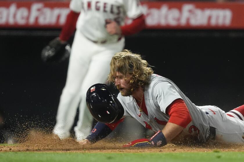 St. Louis Cardinals' Brendan Donovan slides home to score off a single from Matt Carpenter during the seventh inning of a baseball game against the Los Angeles Angels, Monday, May 13, 2024, in Anaheim, Calif. (AP Photo/Ryan Sun)