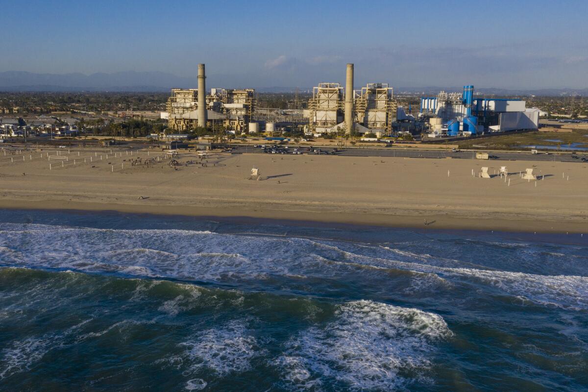 This photo shows two power plants and the ocean