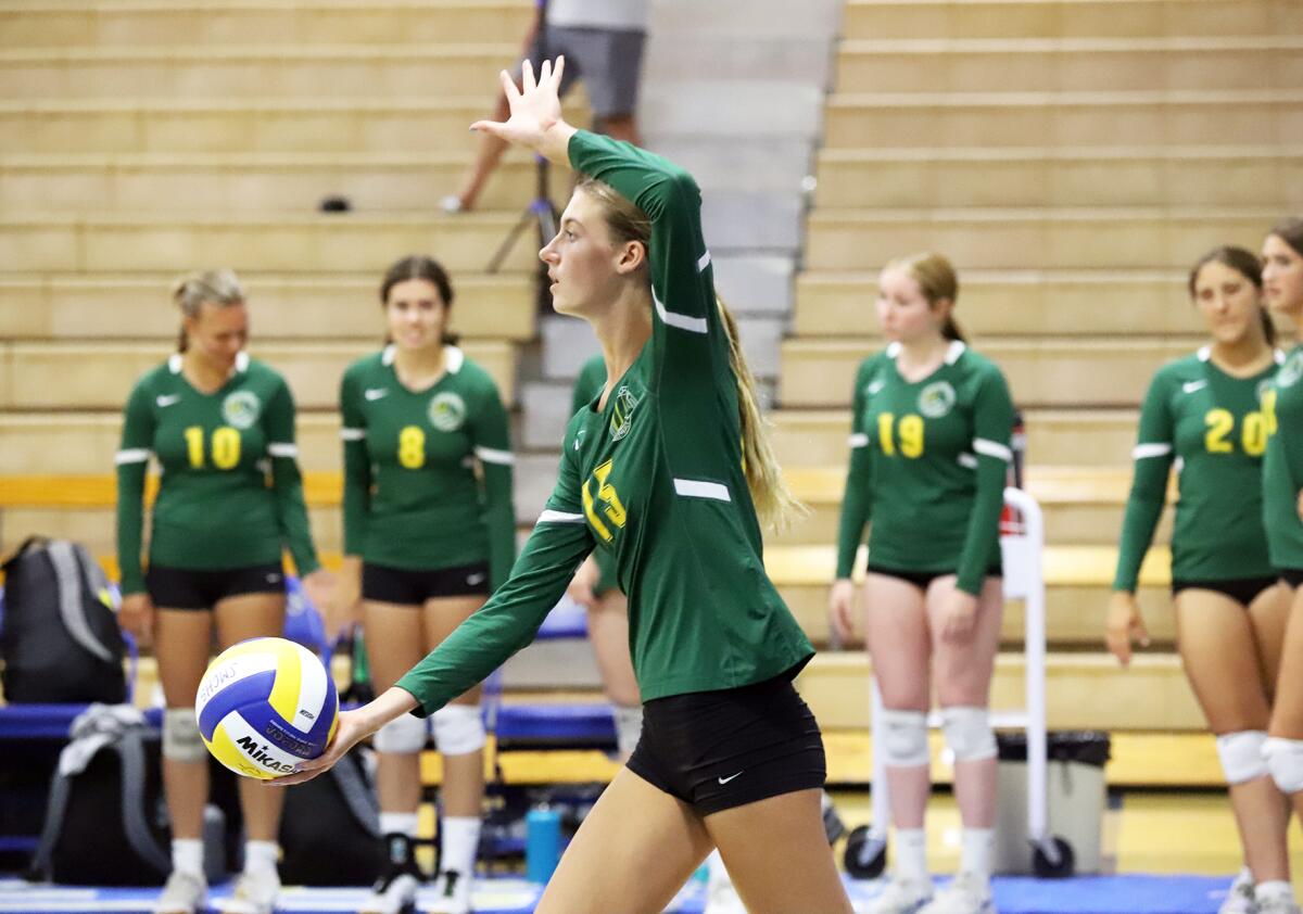 Edison's Molly McCluskey (15) prepares to serve against Santa Margarita in the Trinity-Sunset League Showcase on Thursday.